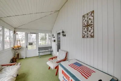 a room with a table with an american flag on it at Historic Alexandria Home with Private Yard! in Alexandria