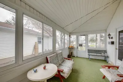 a screened in porch with a table and chairs at Historic Alexandria Home with Private Yard! in Alexandria
