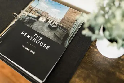 a sign for the perrine house on a table at The Penthouse- Heart of OTR w/Rooftop Terrace in Cincinnati