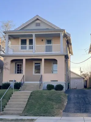 a large house with stairs in front of it at Hunter #2 Private One Bed near Xavier & Downtown in Bellevue