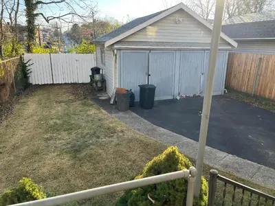 a house with a garage with a driveway at Hunter #2 Private One Bed near Xavier & Downtown in Bellevue