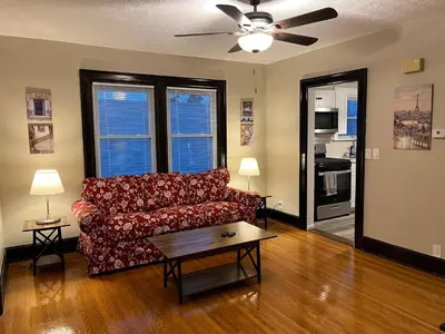 a living room with a couch and a ceiling fan at Hunter #2 Private One Bed near Xavier & Downtown in Bellevue