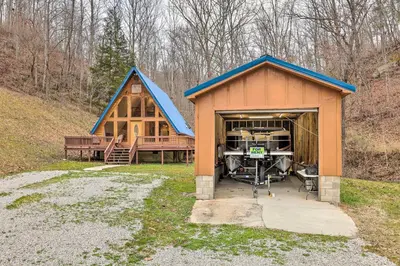 a barn with a car sticking out of it at Cozy Yatesville Lake Cabin Rental in Louisa! in Louisa