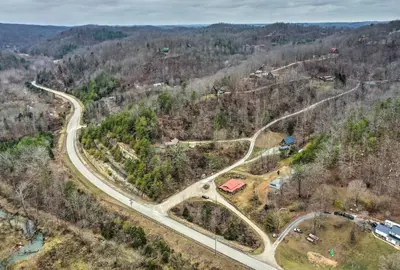 an aerial view of a road in the woods at Cozy Yatesville Lake Cabin Rental in Louisa! in Louisa