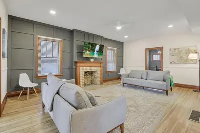 a living room with two couches and a fireplace at Updated 4BD House Near German Village w Parking in Columbus