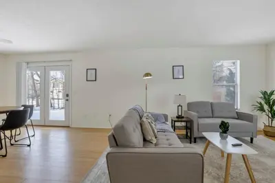 a living room with a couch and a table at Housepitality - The Gahanna Hideaway in Gahanna
