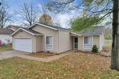 a house with a garage in a yard at The Spacious Hilliard House in Columbus