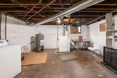 an empty room with a heater and a desk in it at The Cobblestone Townhouse - 2 BR -German Village in Columbus