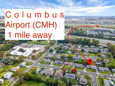 an aerial view of a suburb with a red arrow at Housepitality - The Gahanna Ranch - 3 BR - Airport in Gahanna