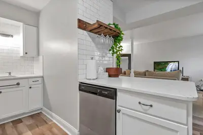 a kitchen with white cabinets and a dishwasher at German Village Hidden Gem - 3 BR, Parking l Value in Columbus