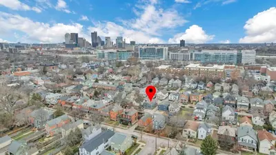 a red balloon in the air over a city at Housepitality - Top Choice Flat - Location in Columbus