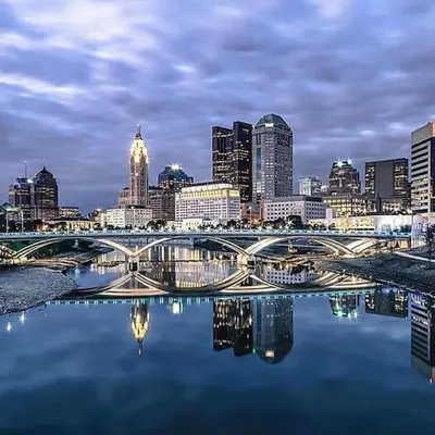 a view of a city with a bridge over the water at Housepitality - Top Choice Flat - Location in Columbus