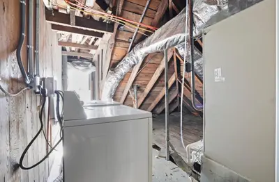 a room with a washing machine in a building at Housepitality - City View Loft - German Village in Columbus