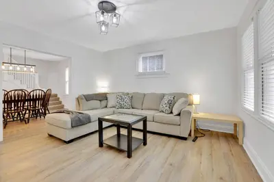 a living room with a couch and a table at Housepitality- The 614 Peaceful Escape - Old Town in Columbus