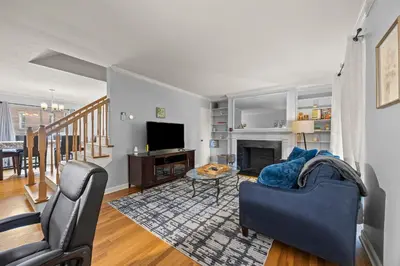 a living room with a couch and a fireplace at Heated, Cozy 3BR Perfect for Winter Getaways in Columbus