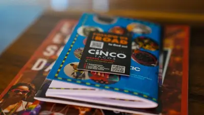 a stack of magazines sitting on top of a table at Heated, Cozy 3BR Perfect for Winter Getaways in Columbus