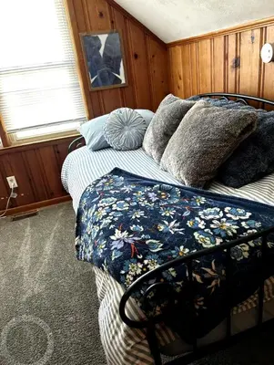 a bedroom with two beds with pillows on it at Relaxing 4BR Holiday Retreat Large, Cozy & Close to Airport in Columbus