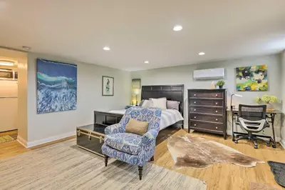a bedroom with a bed and a desk and a chair at Northern Kentucky Studio Near Cincinnati! in Southgate