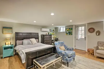 a bedroom with a bed and a chair at Northern Kentucky Studio Near Cincinnati! in Southgate