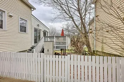 a white fence in front of a house at Northern Kentucky Studio Near Cincinnati! in Southgate