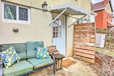 a couch sitting outside of a house with a gate at Northern Kentucky Studio Near Cincinnati! in Southgate