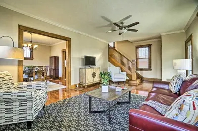 a living room with a couch and a table at Charming and Family-Friendly Zanesville Home! in Zanesville