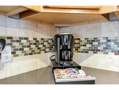 a coffee maker on a counter in a kitchen at Housepitality - Little River Trails in Mason