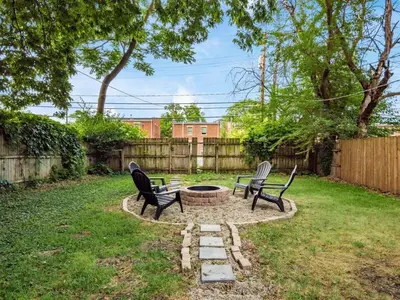 two chairs and a fire pit in a yard at Large 5 Bedroom House Next to OSU, Sleeps 16 in Columbus