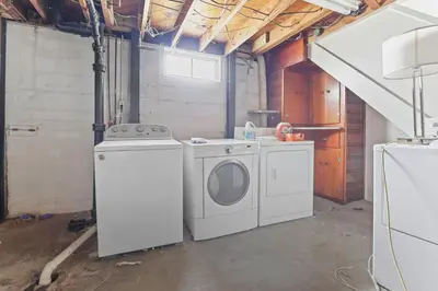 a laundry room with a washer and dryer at Housepitality- The Bungalow -2 BR in Columbus