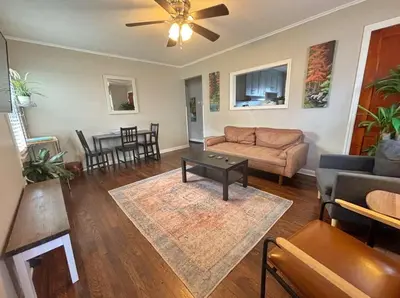 a living room with a couch and a table at Housepitality- The Bungalow -2 BR in Columbus