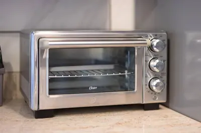 a silver toaster oven sitting on top of a counter at Georgetown Villas Two Bedroom 3-2a Apartment in Fairview Park, Ohio! in Fairview Park