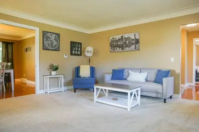 a living room with a couch and a table at 4BR/2.5BA Home boasting 2400sqft and Eat-in KTN in Toledo