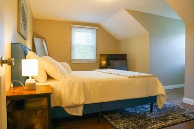 a bedroom with a bed and a window at 4BR/2.5BA Home boasting 2400sqft and Eat-in KTN in Toledo