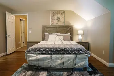 a bedroom with a large bed in a room at 4BR/2.5BA Home boasting 2400sqft and Eat-in KTN in Toledo