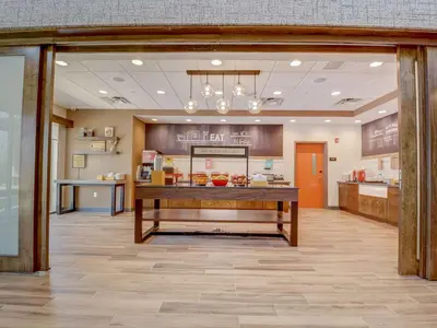 a lobby of a hospital with a table in a room at Hampton Inn & Suites Williamstown Ark Encounter, Ky in Williamstown