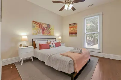 a bedroom with a bed and a ceiling fan at OSU and Short North 4 Bedroom Patio and Garage with EV in Columbus