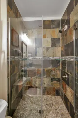 a bathroom with a shower with a glass door at OSU and Short North 4 Bedroom Patio and Garage with EV in Columbus
