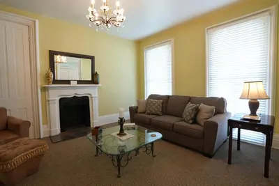 a living room with a couch and a fireplace at Extended Stays by Lee House Inn in Maysville