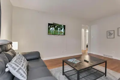 a living room with a couch and a coffee table at Housepitality - The OSU Hideaway - 4 BR 5 min from OSU Grandview in Columbus