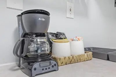 a blender on a counter next to a pile of paper towels at Housepitality - The Restful Studio - Cozy in Newark