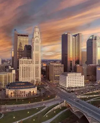 a city skyline with a highway in front of buildings at Housepitality - The Lilley Pad - Near Downtown in Columbus
