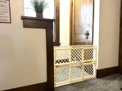 a door in a hallway with a plant on it at King Bed, 2 Full Baths, Large Deck, Free Bikes, 2 miles to Downtown & Sports Fieldhouse in Fort Wayne