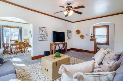 a living room with a couch and a ceiling fan at King Bed, 2 Full Baths, Large Deck, Free Bikes, 2 miles to Downtown & Sports Fieldhouse in Fort Wayne
