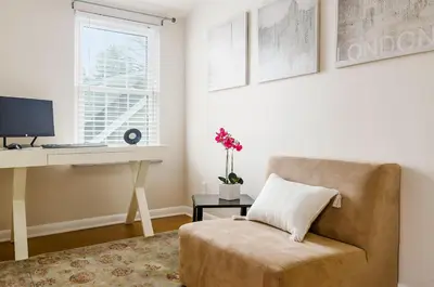 a living room with a chair and a desk at Bexley Family Friendly, Staycation, King Bed in Columbus