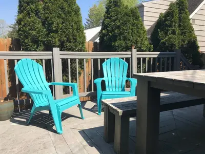 two blue chairs and a table on a patio at Bexley Family Friendly, Staycation, King Bed in Columbus