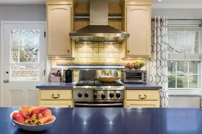a kitchen with a bowl of fruit on a counter at Bexley Family Friendly, Staycation, King Bed in Columbus
