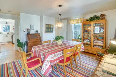 a dining room with a table and chairs at The Porch House Located in Historic Village in Granville