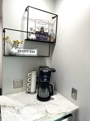 a coffee maker on a counter in a room at Cheerful 4 bedroom home w/ fireplace & game room in Mason