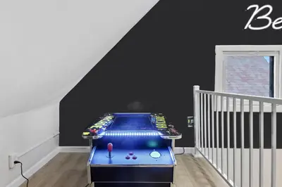 a childs room with a game table in the attic at The Lakewood Belle: Family Friendly Home 10 minutes to Downtown! in Cleveland