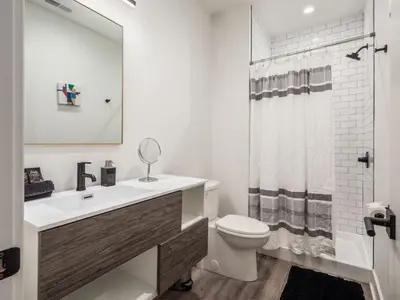 a bathroom with a sink and a toilet and a shower at Historic German Village Industrial Masterpiece in Columbus